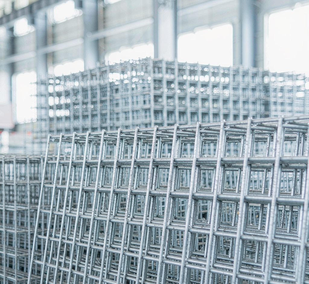 Galvanized welded wire mesh panels stacked in a warehouse