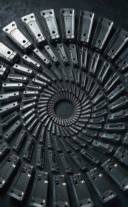 Stamped steel parts arranged in a radial spiral